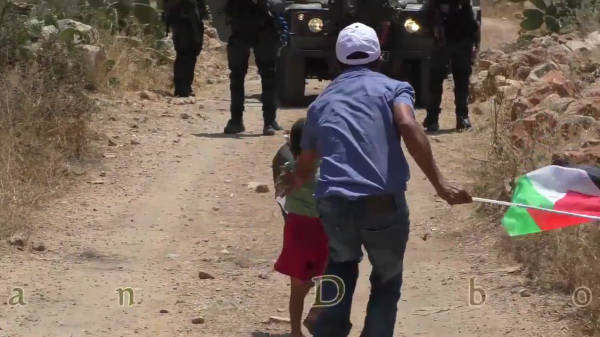 Palestinian child pushed towards soldier video screen shot 2